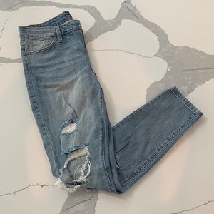 Distressed, light wash skinny jeans. Long length.